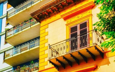 Apartment in residential building exterior. Housing structure at blue modern house of Europe. Rental home in city district on summer. Wall and glass high architecture for business property investment.の写真素材