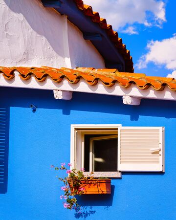 Apartment in residential building exterior. Housing structure at blue modern house of Europe. Rental home in city district on summer. Wall and glass high architecture for business property investment.の写真素材
