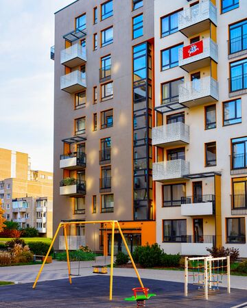 Apartment in residential building exterior. Housing structure at blue modern house of Europe. Rental home in city district on summer. Architecture for business property investment, Vilnius, Lithuania.の写真素材
