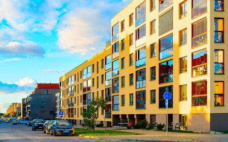 Apartment in residential building exterior. Housing structure at blue modern house of Europe. Rental...
