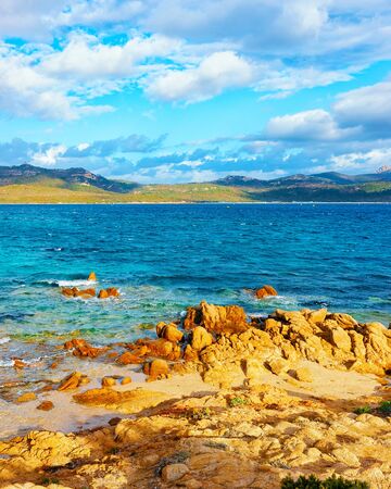 Romantic sunny sunrise on Capriccioli Beach of Costa Smeralda reflexの写真素材