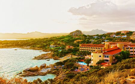 Sunrise at Capo Ferro at the Mediterranean sea reflexの写真素材
