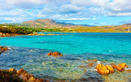 Romantic sunny sunrise at Capriccioli Beach in Costa Smeralda reflexの写真素材