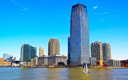 Jersey City, New Jersey and Hudson River. View from Manhattan, New York of USA. Skyline and cityscape with skyscrapers at United States of America, NYC, US. Road and American architecture.の写真素材