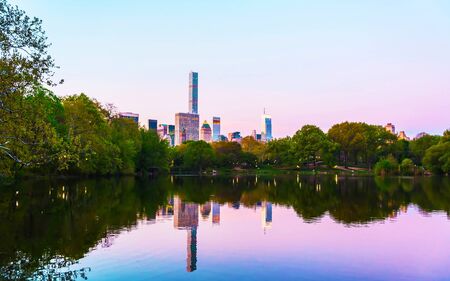 Pond at Central park New York, great design for any purposes. Midtown Manhattan, USA. View with Skyline of Skyscrapers architecture in NYC. Nature background. Urban cityscape. NY, USの写真素材
