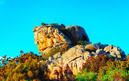 Rural landscape with hills and highland of Costa Smeralda. Panorama with Mountains in Sardinia island of Italy. Scenery of Sardegna in summer. Olbia province. Mixed media.の写真素材