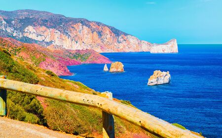 Landscape at Porto Corallo in Nebida and the coast of Mediterranean Sea at Carbonia-Iglesias, Sardinia, Italy. Scenery of Sardegna, summer. Cagliari province, Porto Cervo. Mixed media.の写真素材