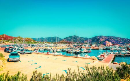 Old Sardinian Port and marina with ships at Mediterranean Sea in city of Villasimius in South Sardinia Island Italy in summer. Cityscape with Yachts and boatsの写真素材