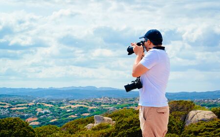 Man and Landscape with Rocky coast of Capo Testa in Santa Teresa Gallura at the Mediterranean Sea on Sardinia Island in Summer Italy. Scenery of Cagliari province. Mixed media.の写真素材
