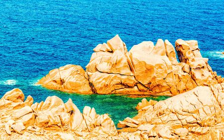 Rocky coast on Capo Testa in Santa Teresa Gallura Sardinia reflexの写真素材