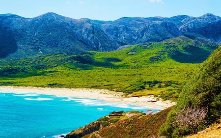 Cala Domestica beach in Buggerru resort Mediterranean Sea Sardinia reflexの写真素材