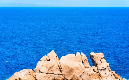 Stones and rocks in Mediterranean sea in Capo Testa reflexの写真素材
