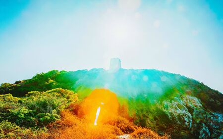 Landscape and Beautiful Scenery with sunset at Ruined tower in Chia. Sunrise and Panorama in South Sardinia island of Italy. Sardegna in summer. Cagliari province. Mixed media.の写真素材