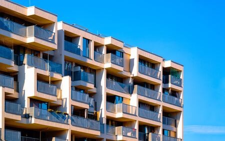 Apartment in residential building exterior. Housing structure at blue modern house of Europe. Rental home in city district on summer. Architecture for business property investment, Salzburg Austria.の写真素材
