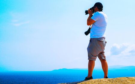 Man and Landscape with Rocky coast of Capo Testa in Santa Teresa Gallura at the Mediterranean Sea on Sardinia Island in Summer Italy. Scenery of Cagliari province. Mixed media.の写真素材