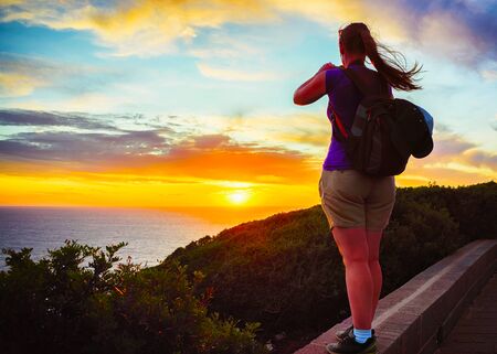 Woman and Landscape at Portoscuso and the coast of Mediterranean Sea at Carbonia-Iglesias, Sardinia, Italy. Girl and Scenery of Sardegna, summer. Cagliari province. Mixed media.の写真素材