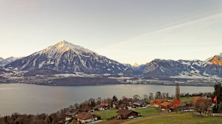 Winter in Swiss Alps mountains near the Thun lake. Mixed media.の写真素材