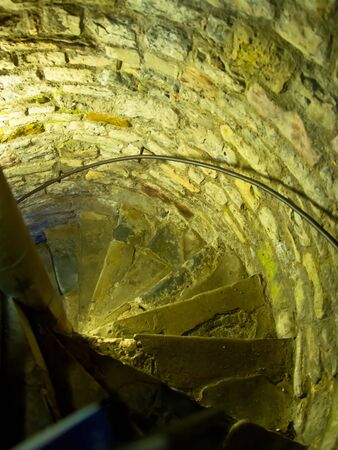 Spiral stair in the medieval castle tower. Mixed media.の写真素材