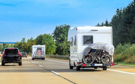 Caravans with bicycles on the road in Switzerland. Mixed media.の写真素材