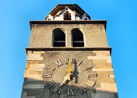 Fragment of Clock tower of Madeleine Church at the old town in Geneva, Switzerland. Mixed media.の写真素材
