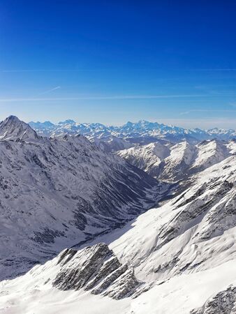 Swiss alpine peaks landscape panorama of Bern Highland helicopter view. Mixed media.の写真素材