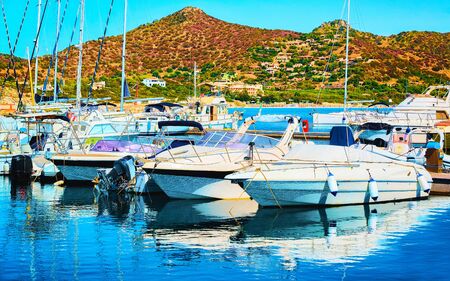 Old Sardinian Port and marina with ships at Mediterranean Sea in city of Villasimius in South Sardinia Island Italy in summer. Cityscape with Yachts and boatsの写真素材