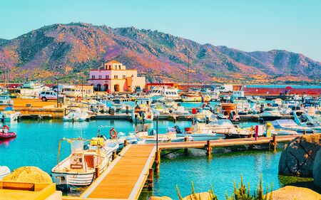 Old Sardinian Port and marina with ships at Mediterranean Sea in city of Villasimius in South Sardinia Island Italy in summer. Cityscape with Yachts and boatsの写真素材