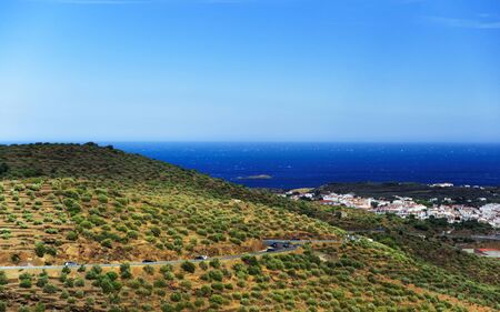 Beautiful road in the countryside near Cadaques in the Mediterranean Sea in summer, Catalonia, Girona province, Costa Brava coast. Mixed media.の写真素材