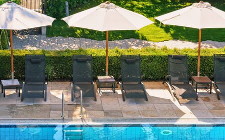Sunbeds at swimming pool at Geneva Lake Montreux Swiss Riviera. Mixed media.の写真素材