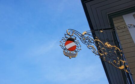 Street sign wiith gold plating on a building in the Old City of Thun. Thun is a city in Swiss canton of Bern, where Aare river flows out of Lake Thun. Town Hall Square is a historic center of the city. Mixed media.の写真素材