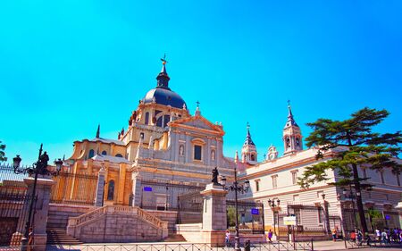 People at Almudena Cathedral in Madrid, Spain. Mixed media.の写真素材