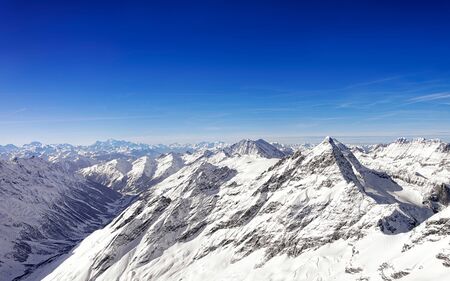 Swiss alpine Jungfrau peak and highland landscape panorama of Bern Highland helicopter view. Mixed media.の写真素材