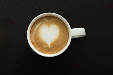 Latte Art on Wooden Background
