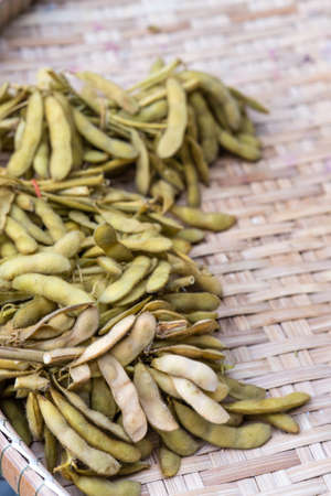 Japanese Pigeon Pea on Bamboo Weave Background