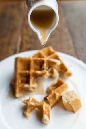 Waffle with Pouring Maple Syrup