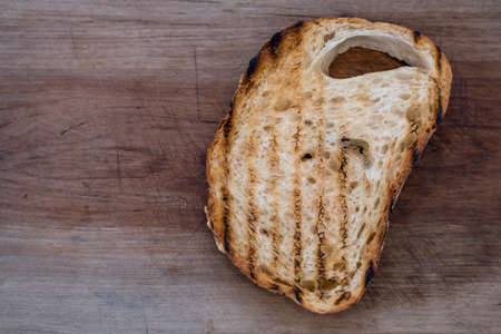 toasted bread on wooden backgroundの写真素材