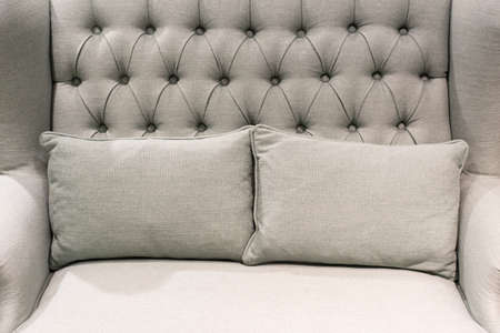 grey pillows on matched grey sofa