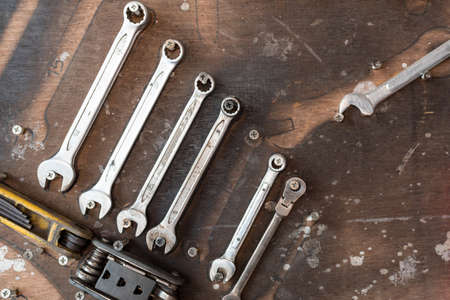 wrench hanging on wooden wallの写真素材