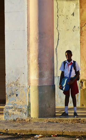 Cuba , Havana , Light and Shadow 4 , school boy waiting bus   のeditorial素材
