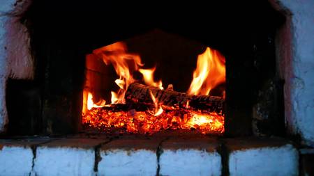 Wood-burning in the russian stoveの写真素材