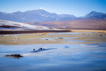 Frozen lake in San pedro de Atacama. Mountains of the Andes in north of Chile.の写真素材