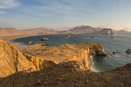 Coast of Paracas in Peru during the sunset, panoramic view of the coast and the desertの写真素材