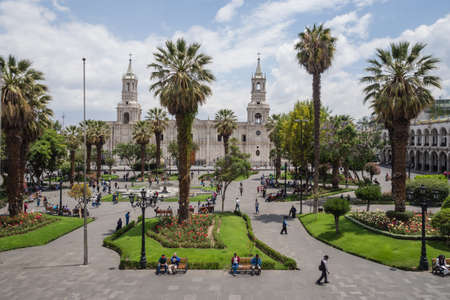 Arequipa city main square and cathedral. Palm and people relaxing and walkingのeditorial素材