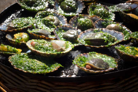 grilled limpets with green mojo, typical avocado in Lanzarote, Canary Islandの写真素材