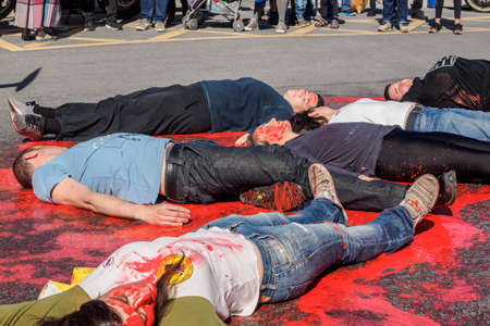 BILBAO, SPAIN - MARCH / 23/2019. People protesting the arrival of the aircraft carrier of the Spanish Navy Juan Carlos I in the port of Bilbao during open day to visit the ship.のeditorial素材