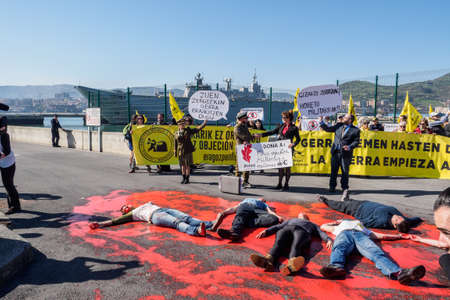 BILBAO, SPAIN - MARCH / 23/2019. People protesting the arrival of the aircraft carrier of the...