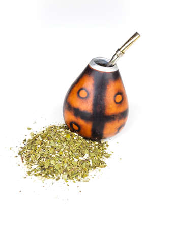Calabash for yerba mate with its bombila with a lot of yerba mate on a white background.