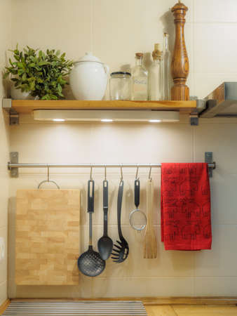 kitchen utensils hanging on the wall.の写真素材