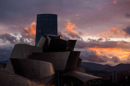 Bilbao riverside near Guggenheim Museum during the sunset, view from La salve bridgeのeditorial素材