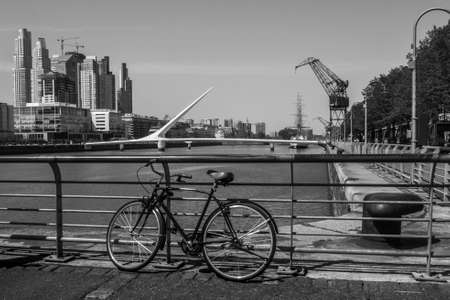 Bicycle in Puerto Madero in Buenos Aires and the Puente de la Mujer in the background, Argentinaの写真素材